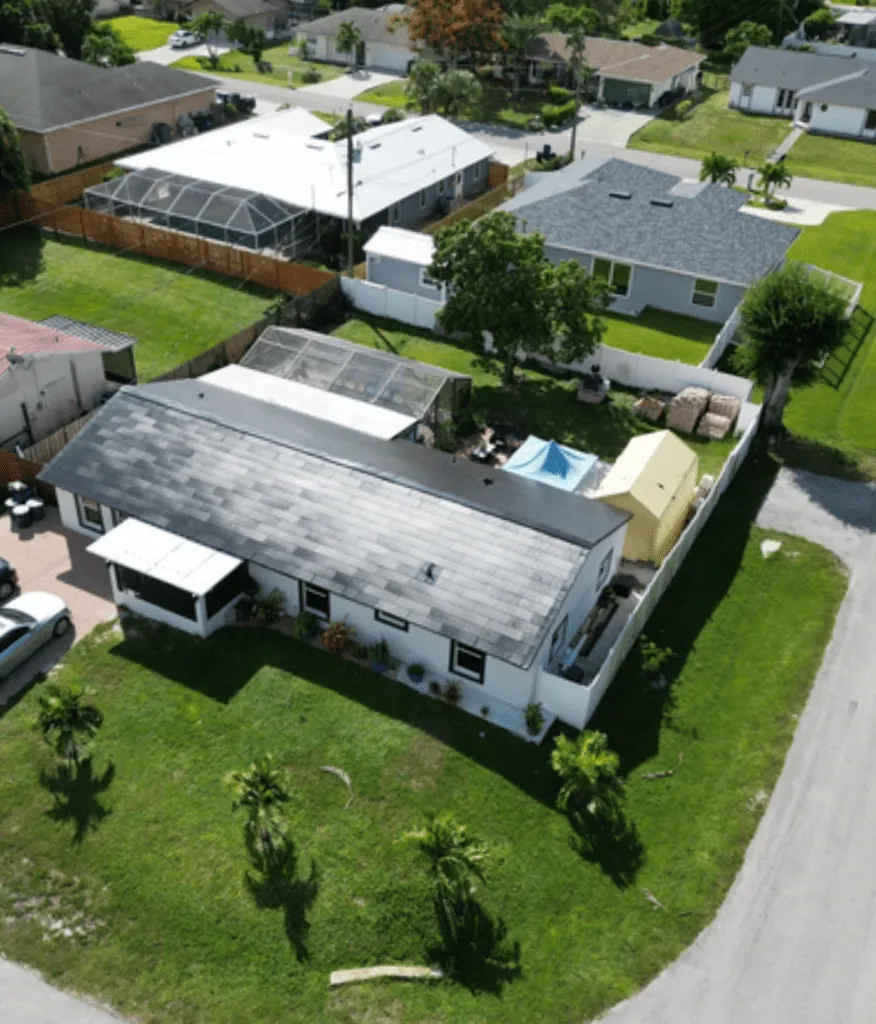 Aerial view of a completed Coastal Energy solar installation in a Florida neighborhood