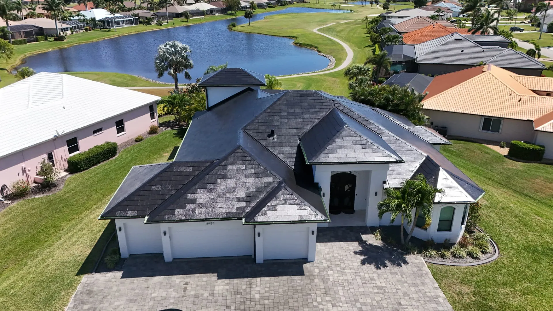 Aerial view of a completed tile roof replacement on a Cape Coral home