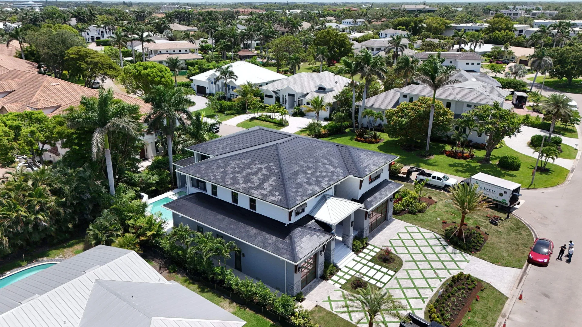Wide aerial of a coastal Fort Lauderdale, Florida estate with a newly installed roof