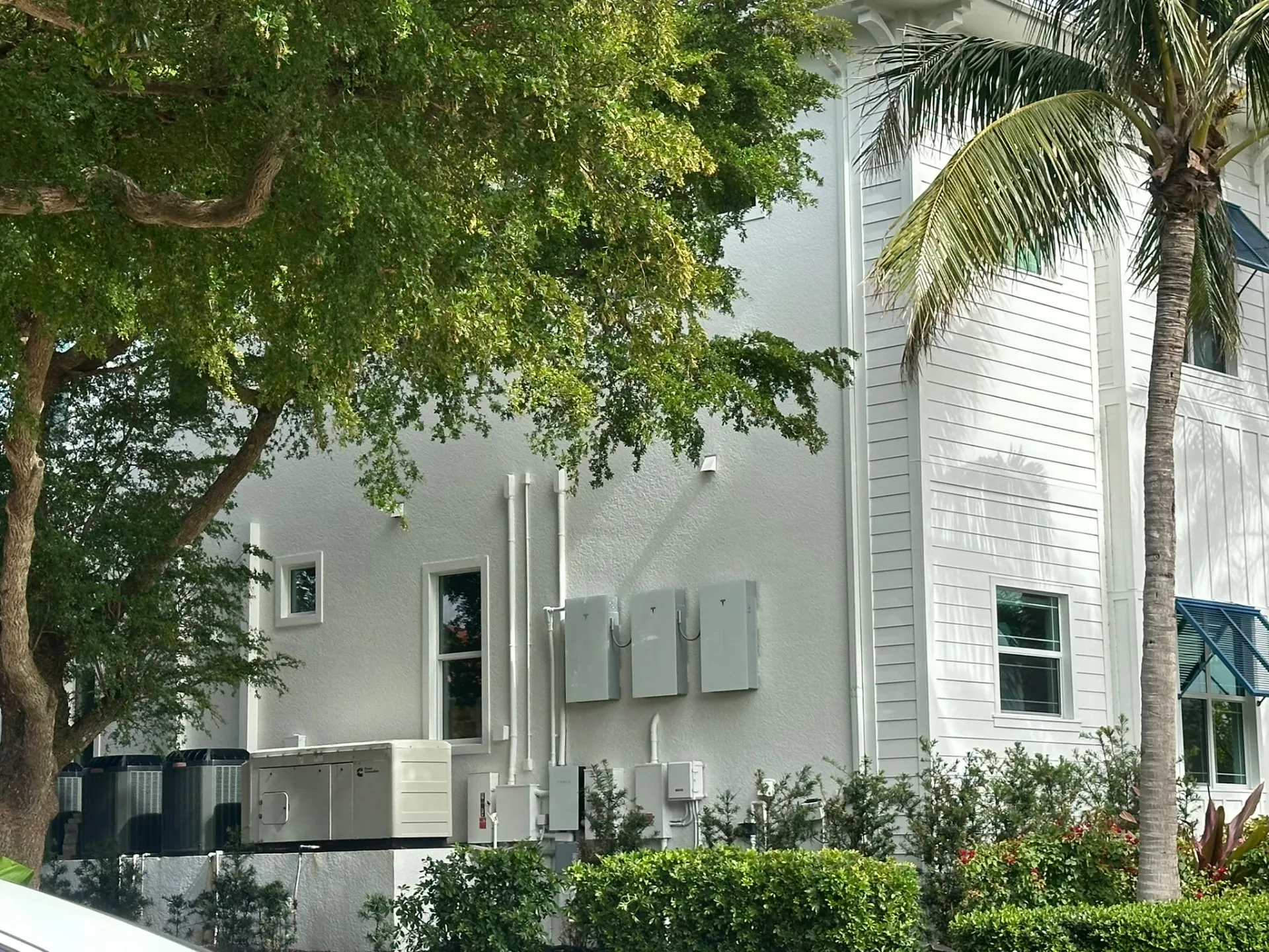Tesla Powerwalls and standby generator on a coastal Boca Raton home