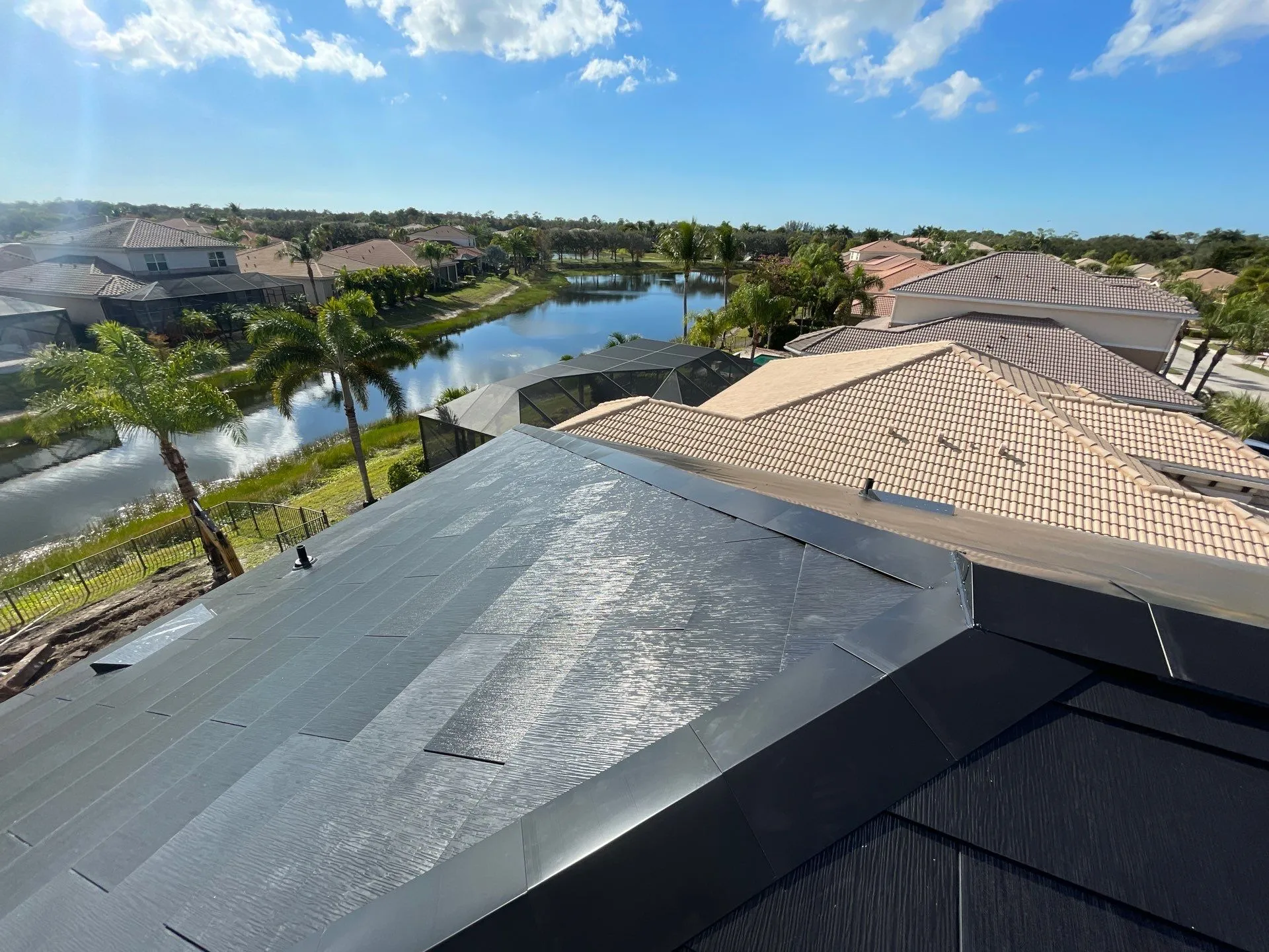 New composite roof overlooking a Florida lake and tile roof neighborhood
