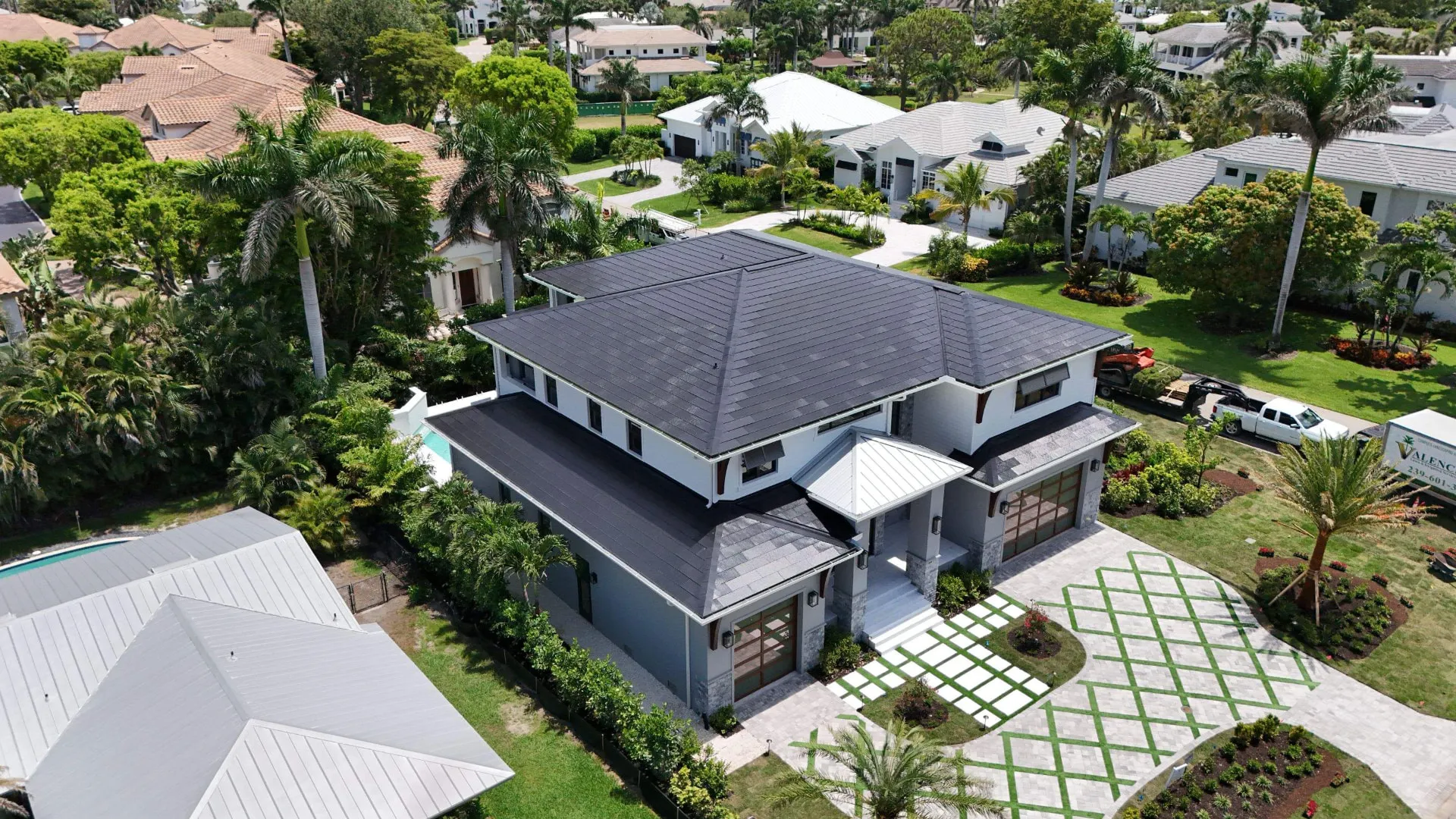 Aerial of a Delray Beach, Florida estate with a new dark tile roof installed by Coastal Energy