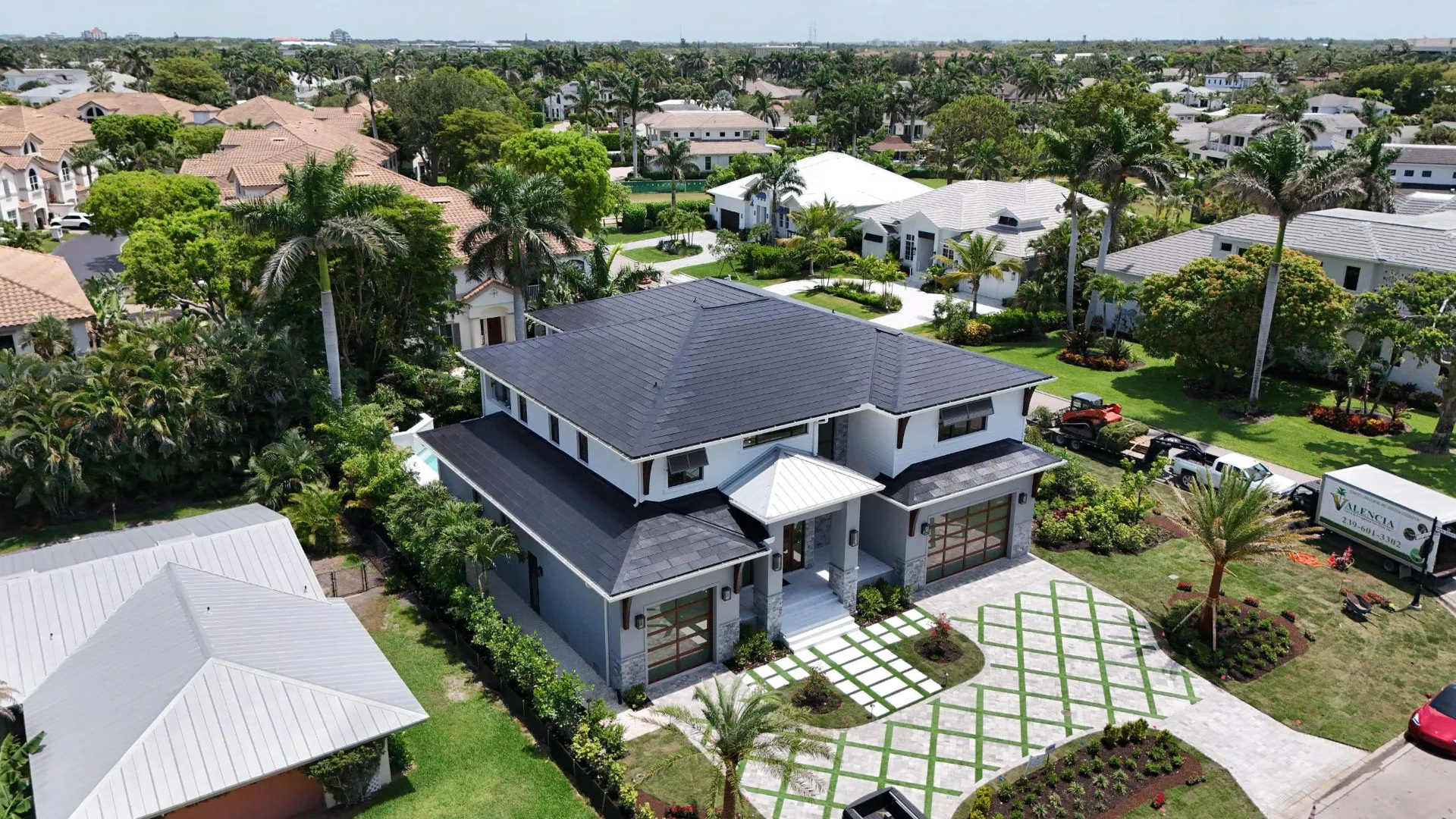 Aerial front elevation of a Pembroke Pines, Florida home with a new roof by Coastal Energy