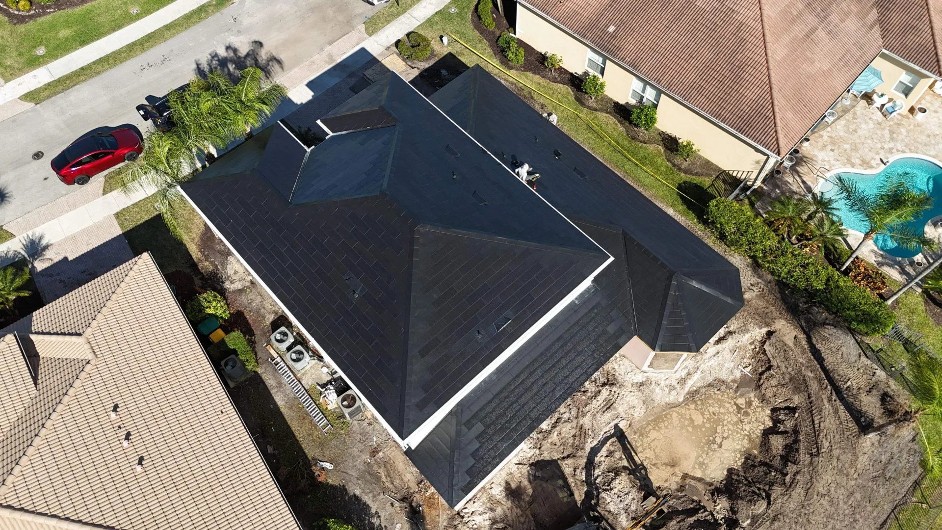 Finished dark roof on a Florida pool home seen from directly above