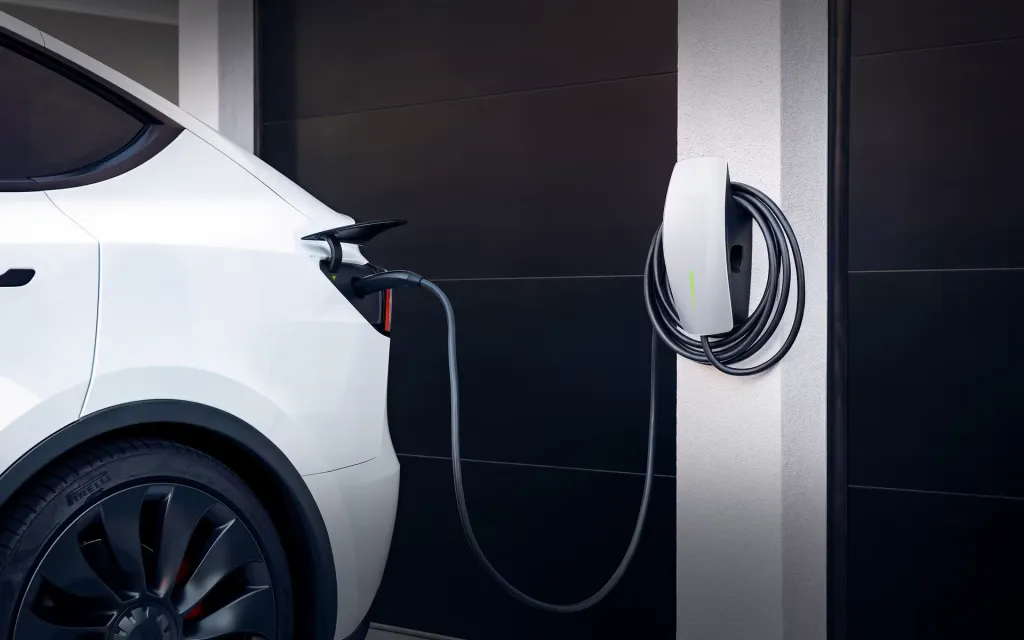 EV charging at a Florida home with solar panels visible on the roof