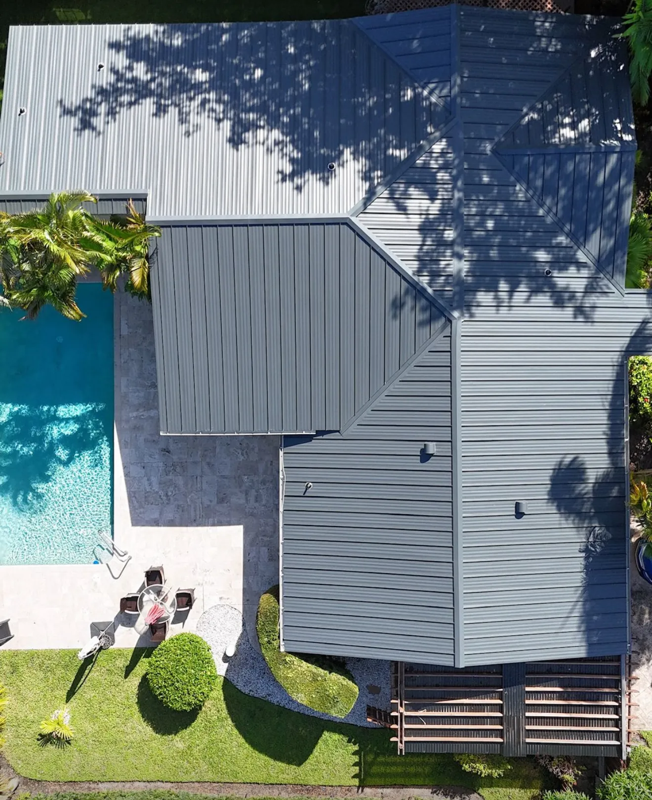 Aerial view of a Cape Coral canal neighborhood with solar ready rooftops
