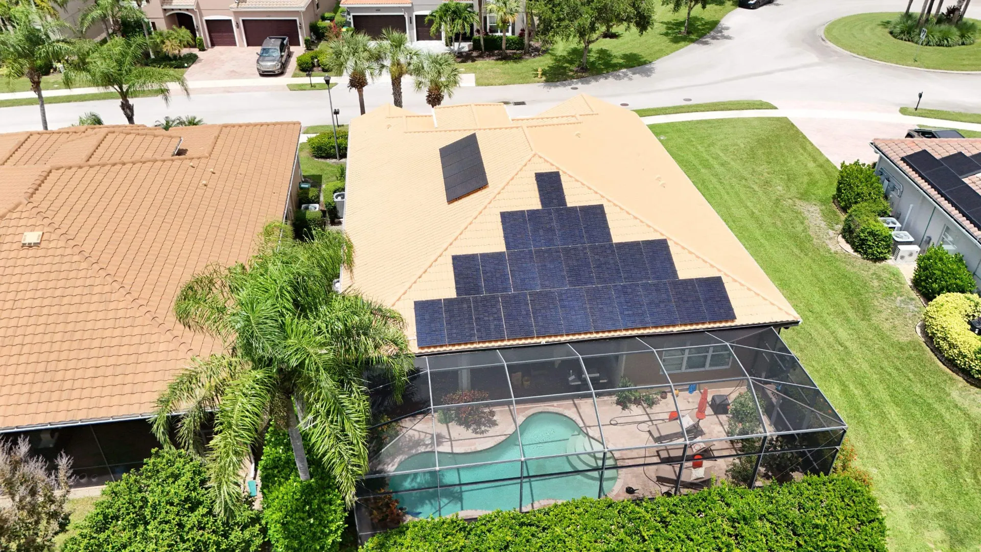 Aerial of a solar array on a tile roof pool home in a North Port, Florida neighborhood