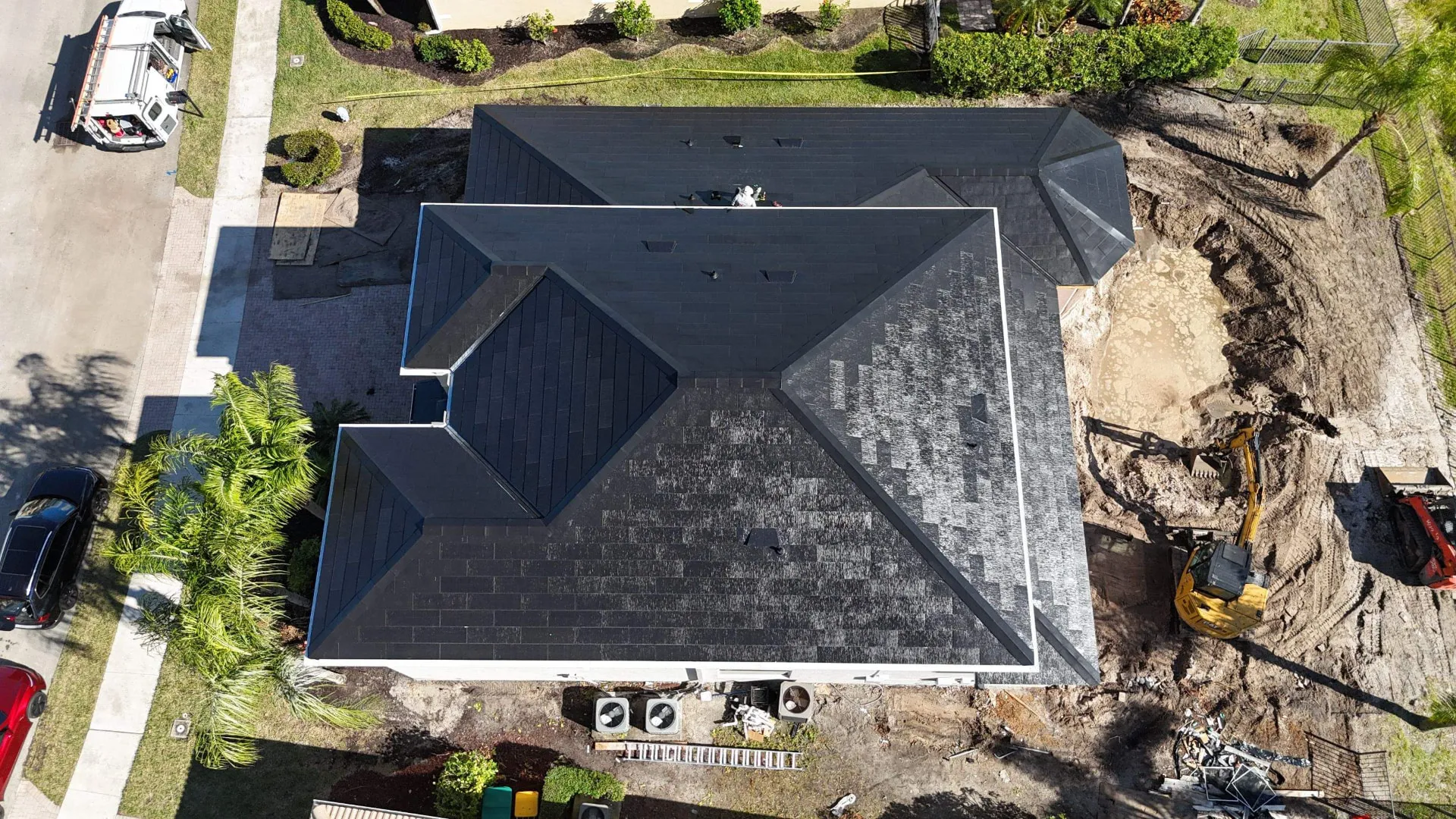 Top down aerial showing underlayment and new roof material going on a Florida home