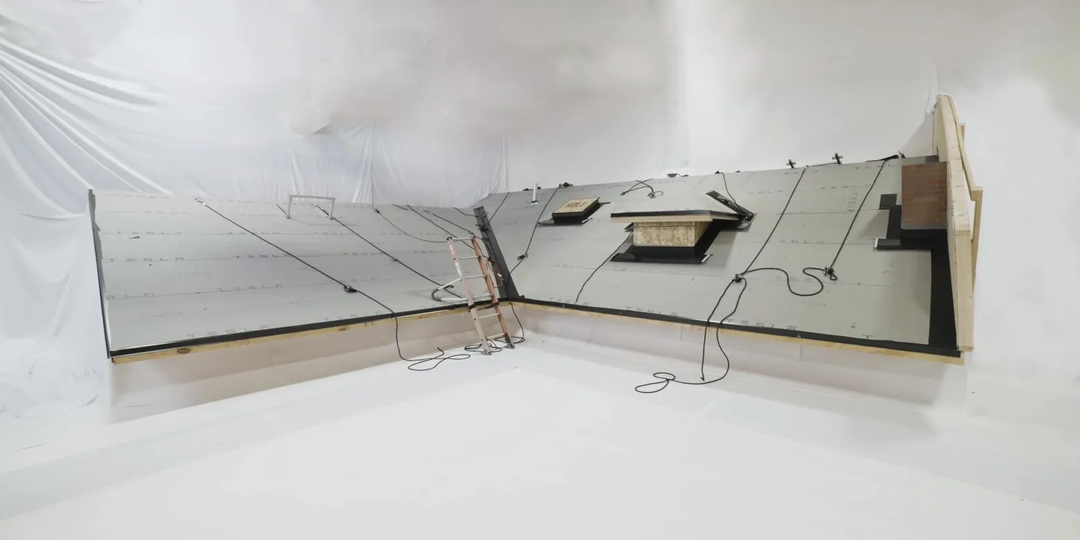 Metal roof panels being installed on a Tampa area home
