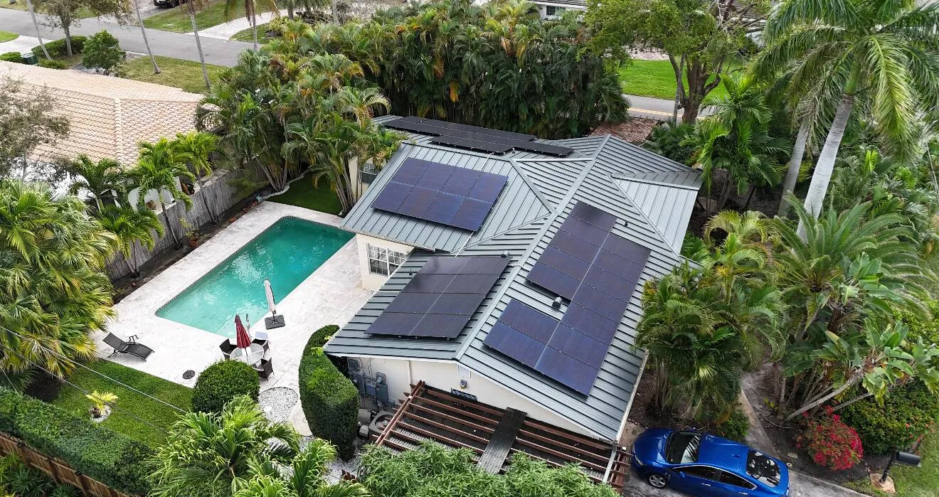 Residential solar panel installation on a standing seam metal roof in Florida