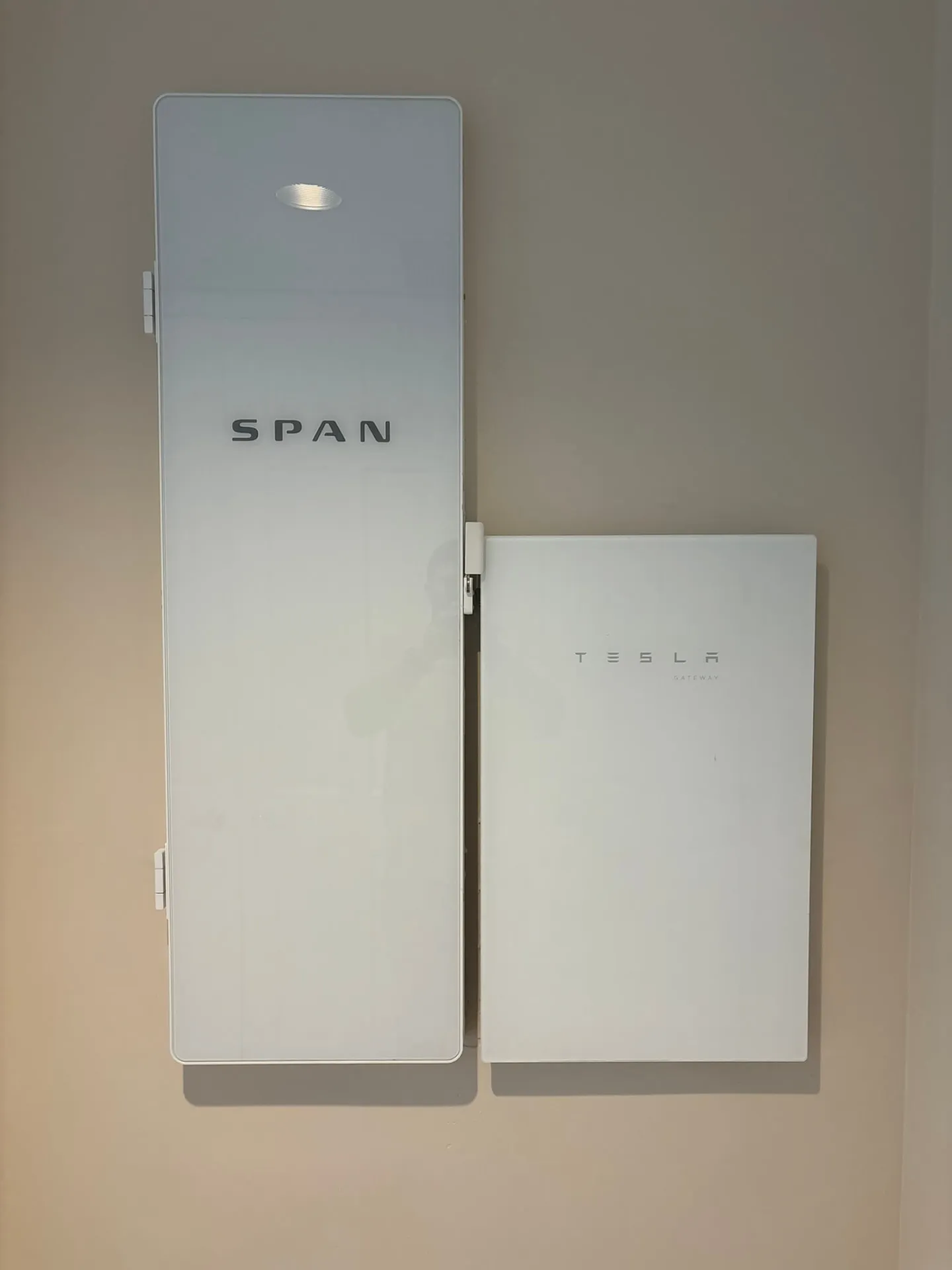 SPAN smart panel beside a Tesla Gateway installed inside a Florida home