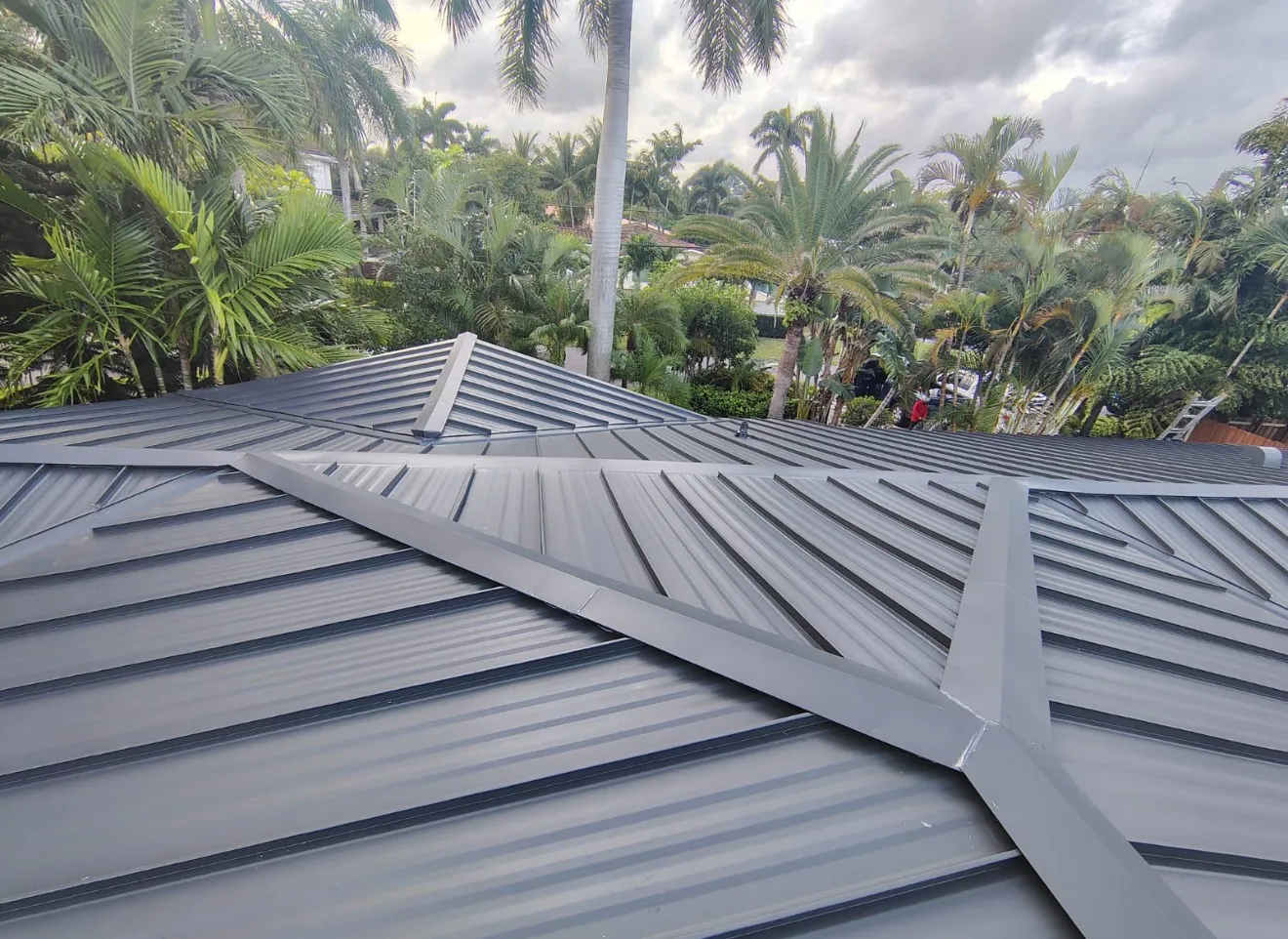 Close view of a finished standing seam metal roof on a Florida home