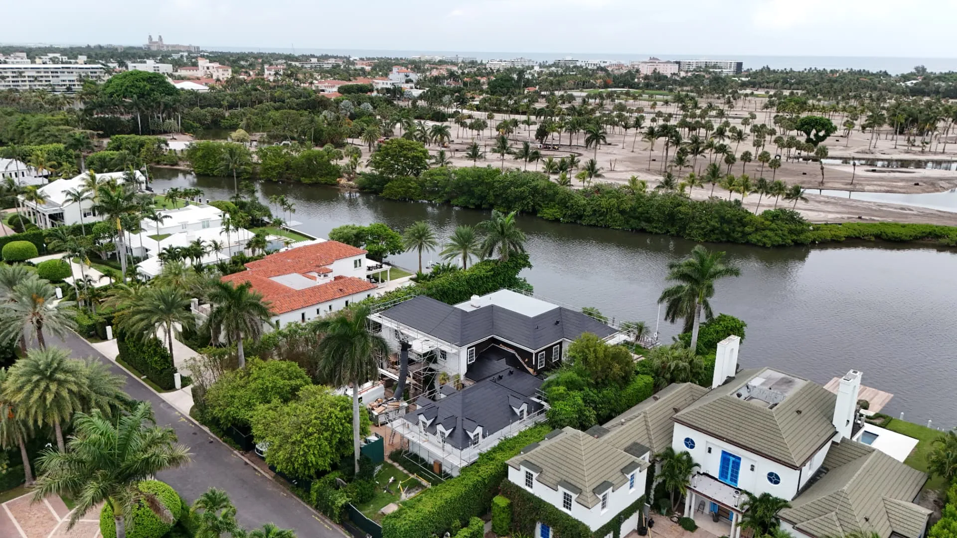 Aerial view of a West Palm Beach waterfront home roof replacement